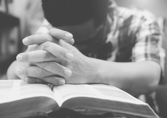 Christian man praying in Kuwait