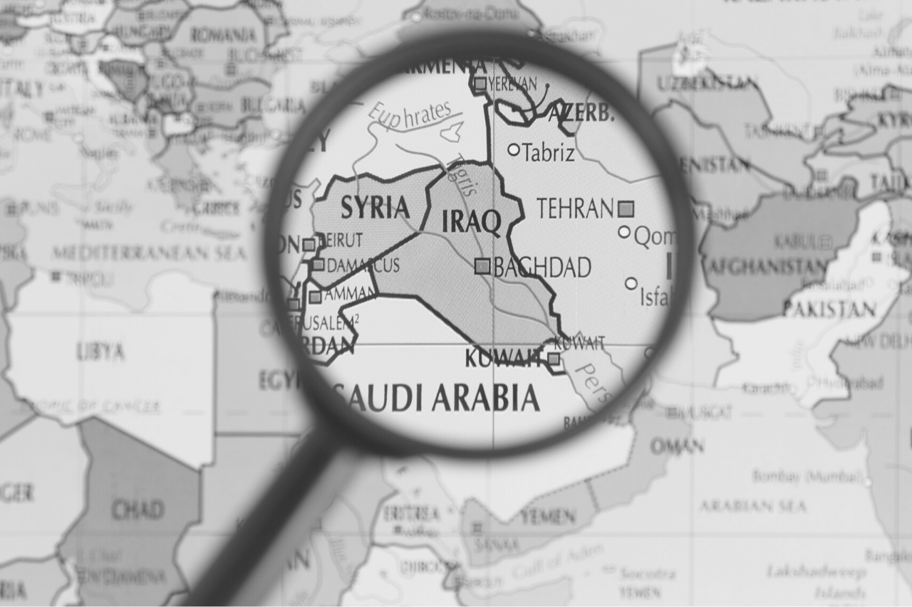 Magnifying glass over Iraq map