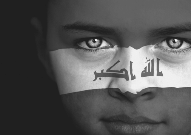 Portrait of a boy with Iraqi flag painted on his face
